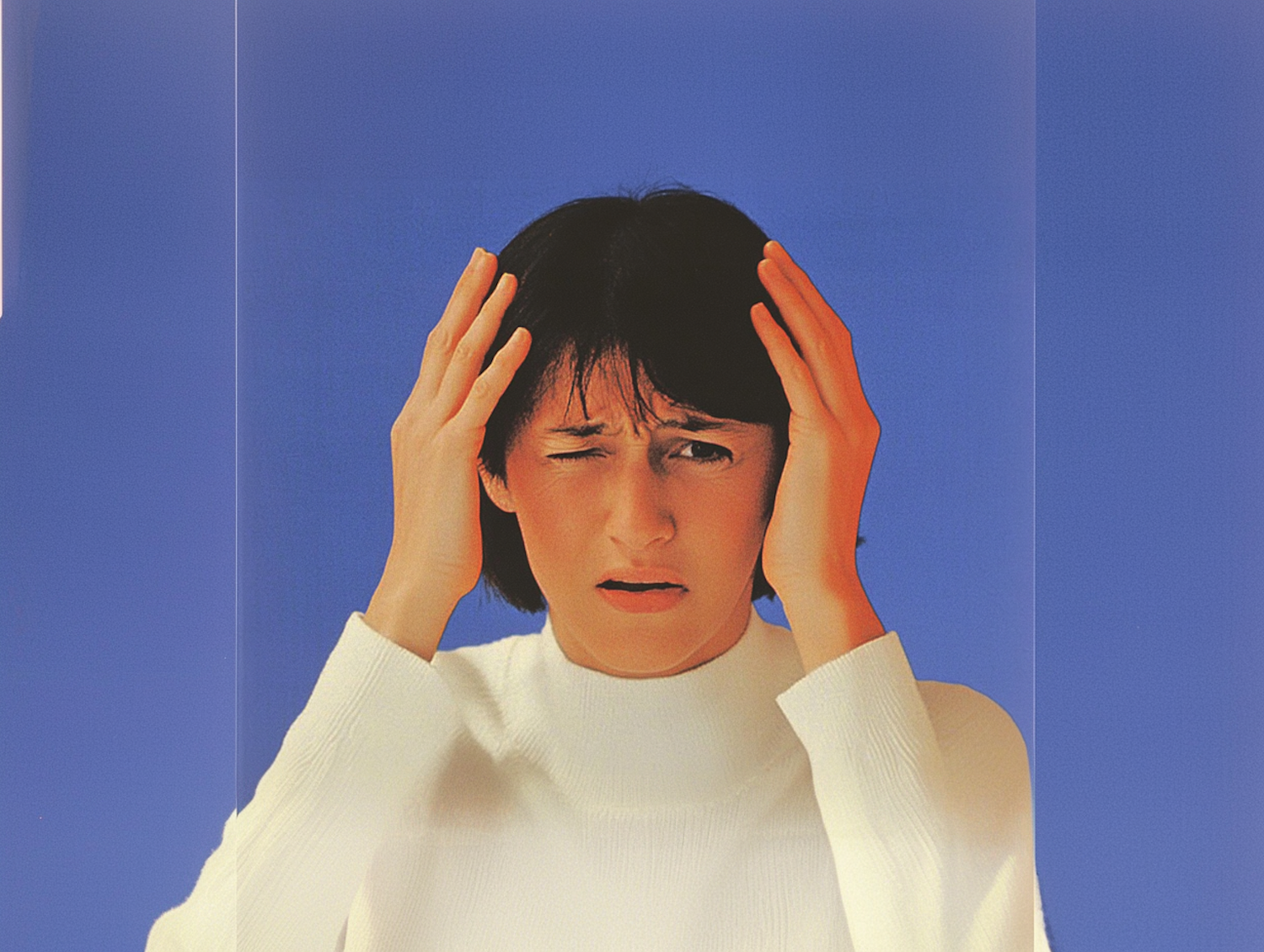 A person appearing overwhelmed or stressed by multiple responsibilities or life changes, symbolizing the environmental triggers for panic attacks.