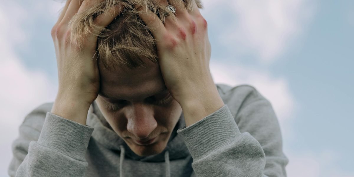 A person experiencing uncertainty and physical sensations, questioning if it's anxiety or another health issue.