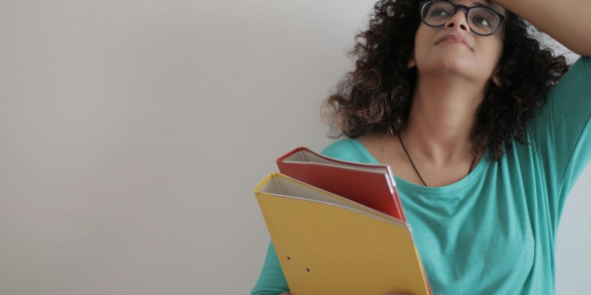 A person feeling overwhelmed and trapped by constant worry and stress, impacting their overall well-being.