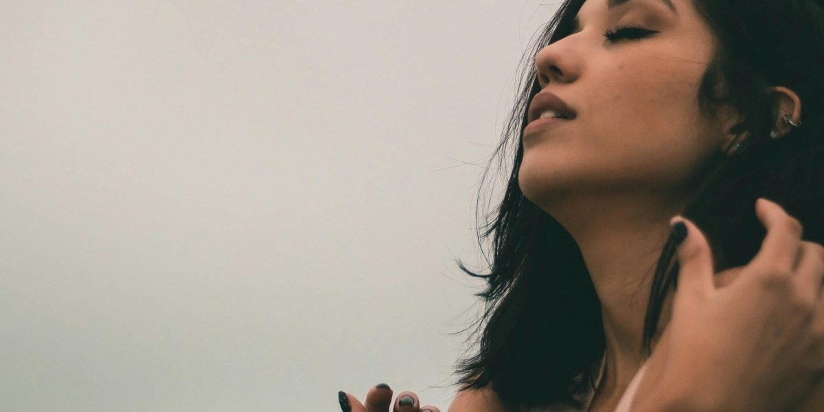 A person exuding confidence and empowerment, representing overcoming obstacles in accessing mental health care.
