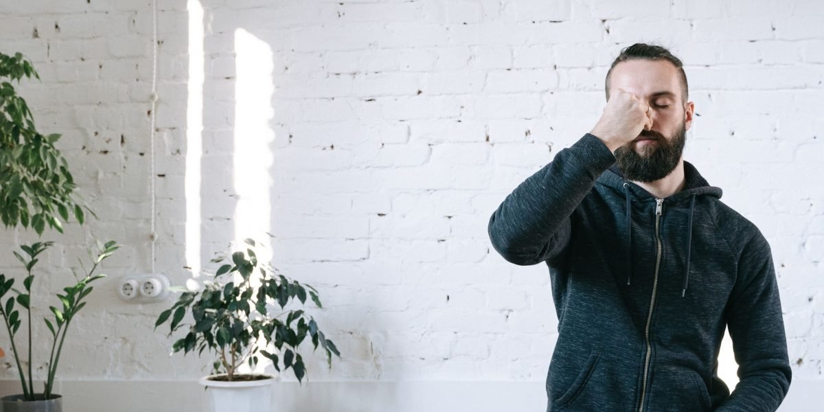 A person calmly practicing a sensory grounding technique, focusing on their surroundings.