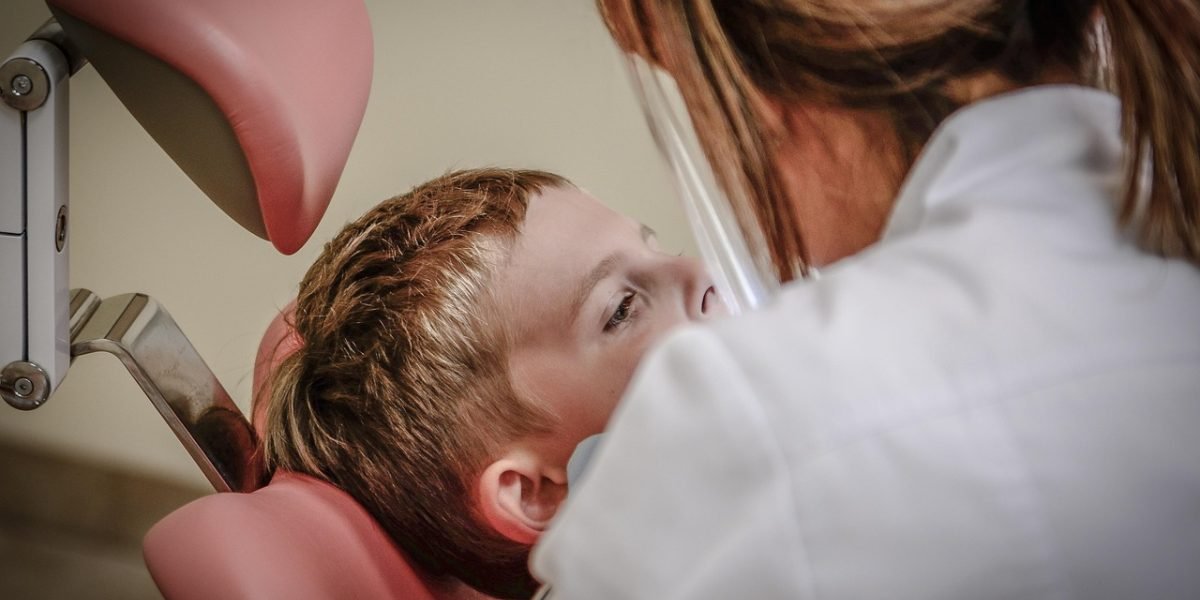 A patient discussing their symptoms with a doctor during a medical consultation.