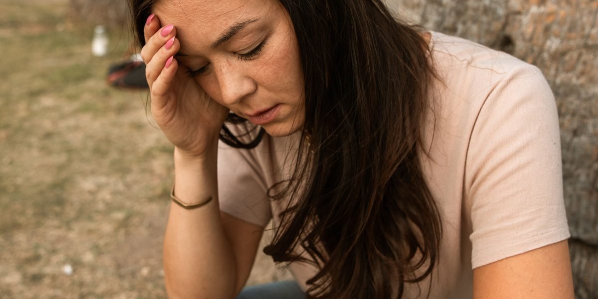 A person appears deep in thought or overwhelmed, reflecting the common struggle with anxiety.