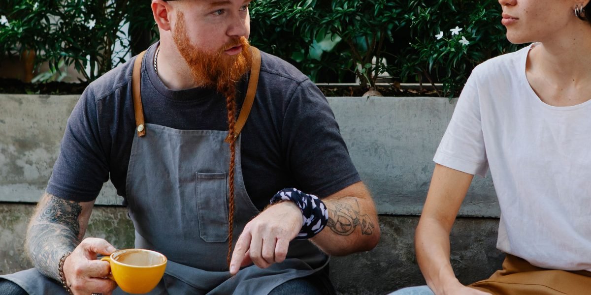 Two friends sharing a supportive conversation in a relaxed setting, highlighting the importance of positive social connections.