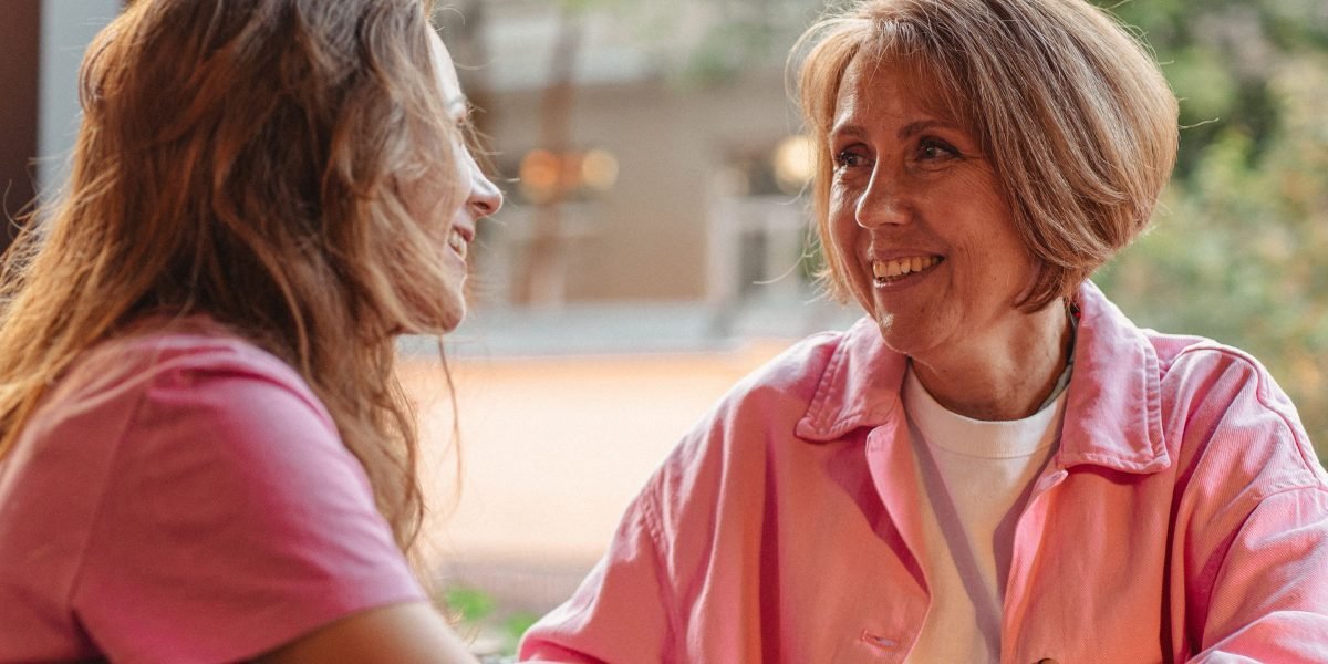 Two friends engaged in a supportive conversation, illustrating the power of social connection.