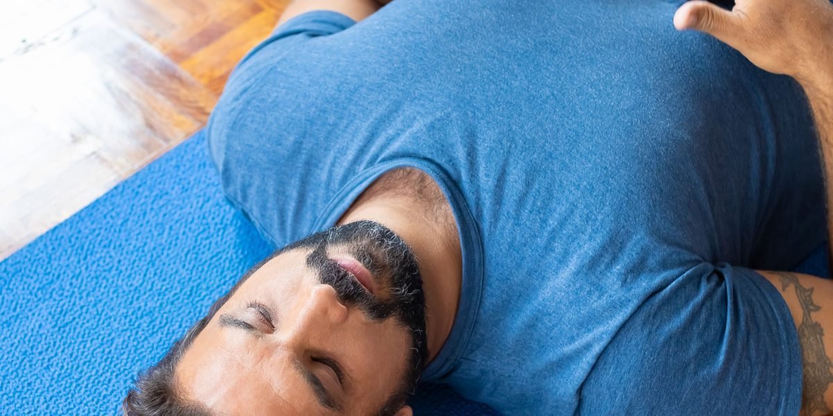 A person quietly focusing, perhaps practicing a breathing exercise or mindfulness technique to manage stress.