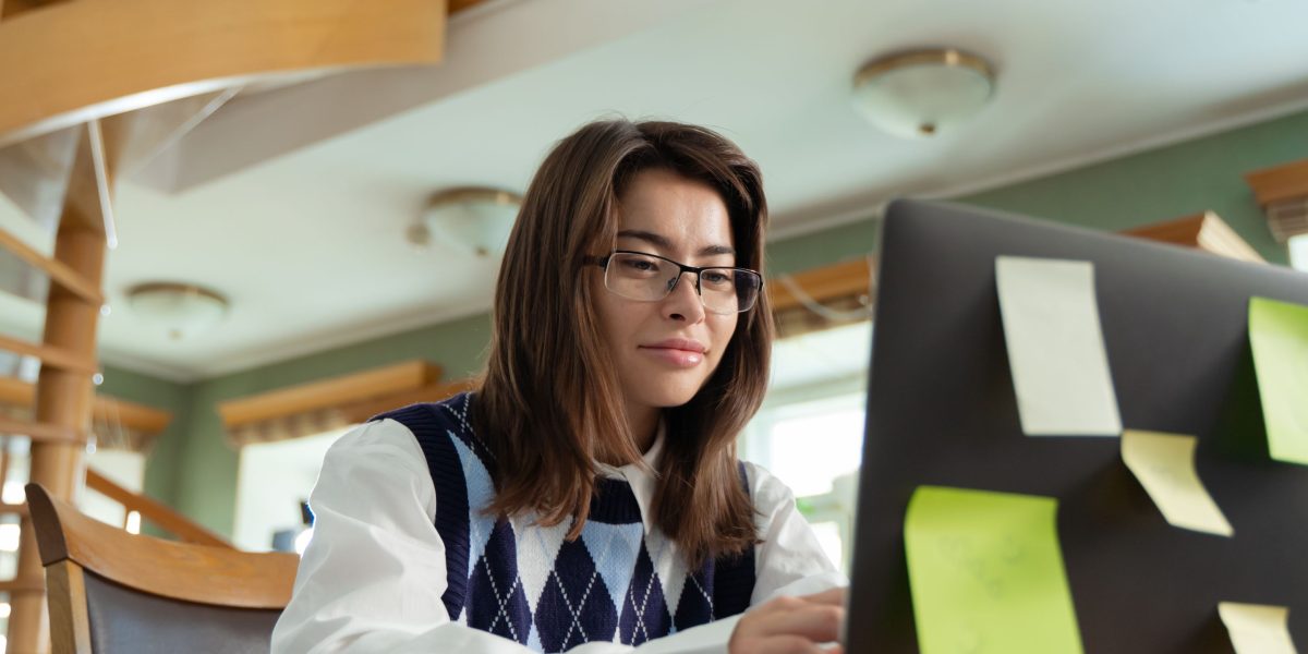 Someone thoughtfully navigating online resources, symbolizing the process of finding a suitable Licensed Professional Counselor.
