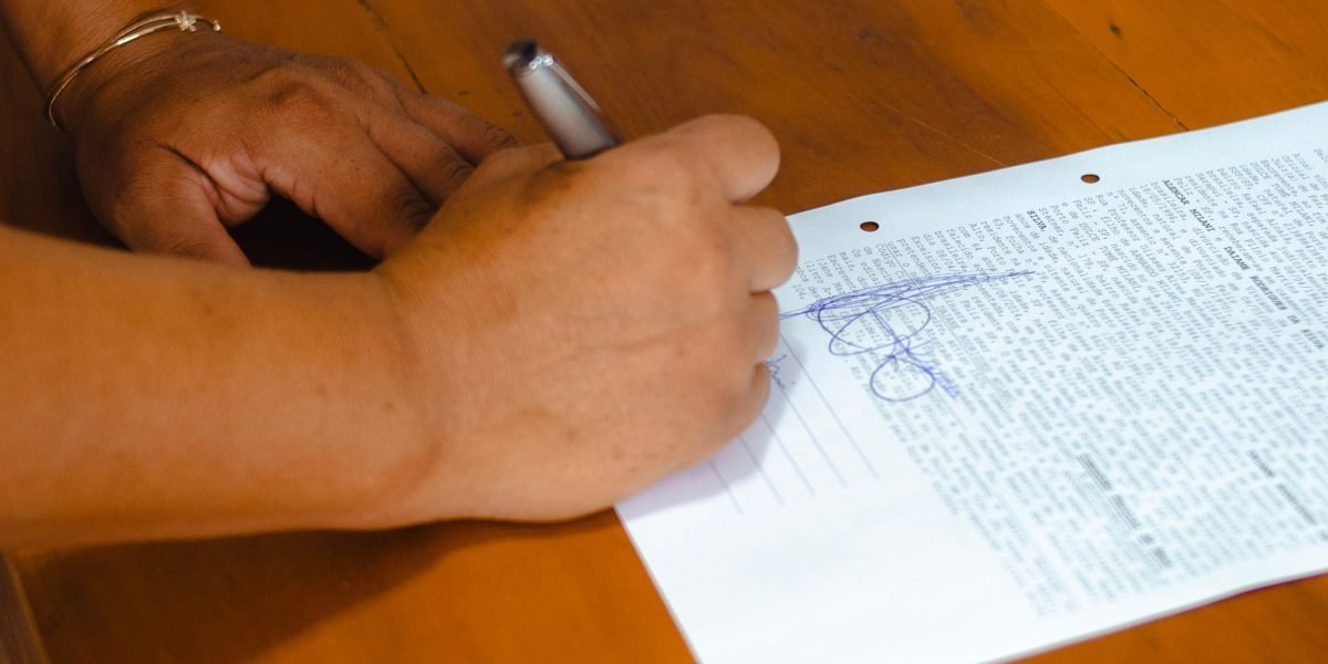A person reviewing documents with a sense of clarity and relief, understanding important information.