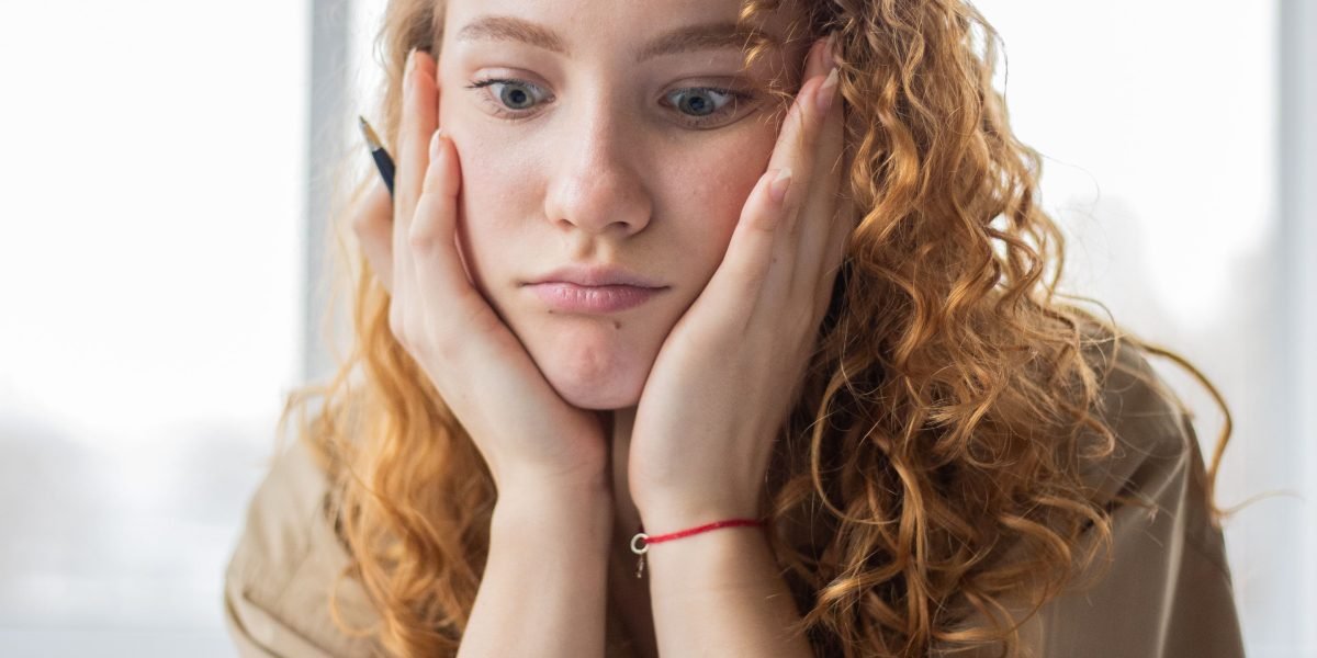 A parent contemplating their child's emotional or behavioral struggles.