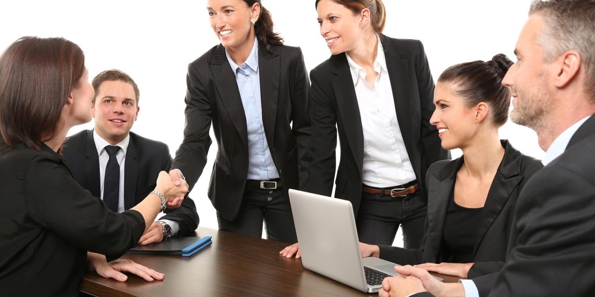 Individuals actively participating in a group discussion, listening and sharing.