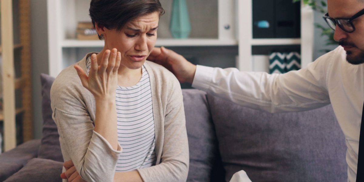 A person feeling heard and understood during a conversation, symbolizing the support found in therapy.