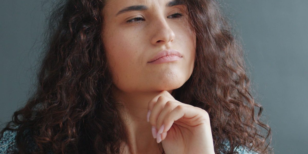 A person thoughtfully considering how internal bodily processes, like hormone regulation, respond to external stressors.