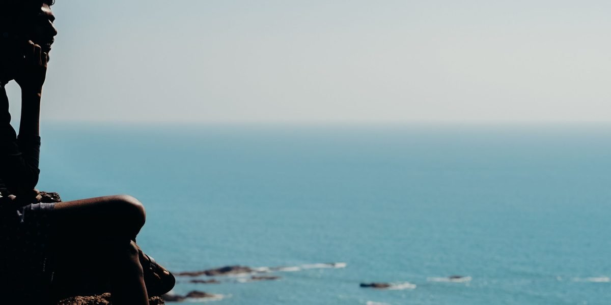 A person reflecting calmly, representing the quiet strength found in seeking mental health support.