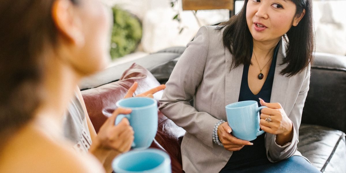 A person engaged in a supportive conversation, illustrating the importance of seeking professional or trusted help when managing panic attacks.